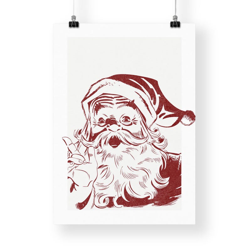 May include: Red and white poster print featuring a vintage illustration of Santa Claus. The image shows Santa with a long white beard, a red hat, and a hand gesture. The artwork has a retro, linocut style.