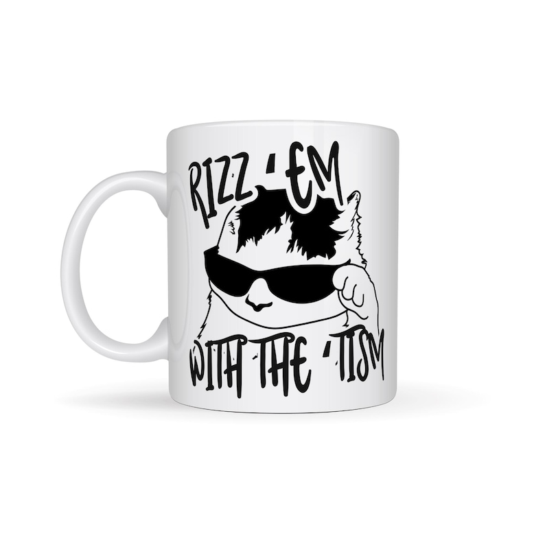 May include: White ceramic mug featuring a black and white illustration of a cat wearing sunglasses and the text "Rizz 'em with the 'tism" printed on it.