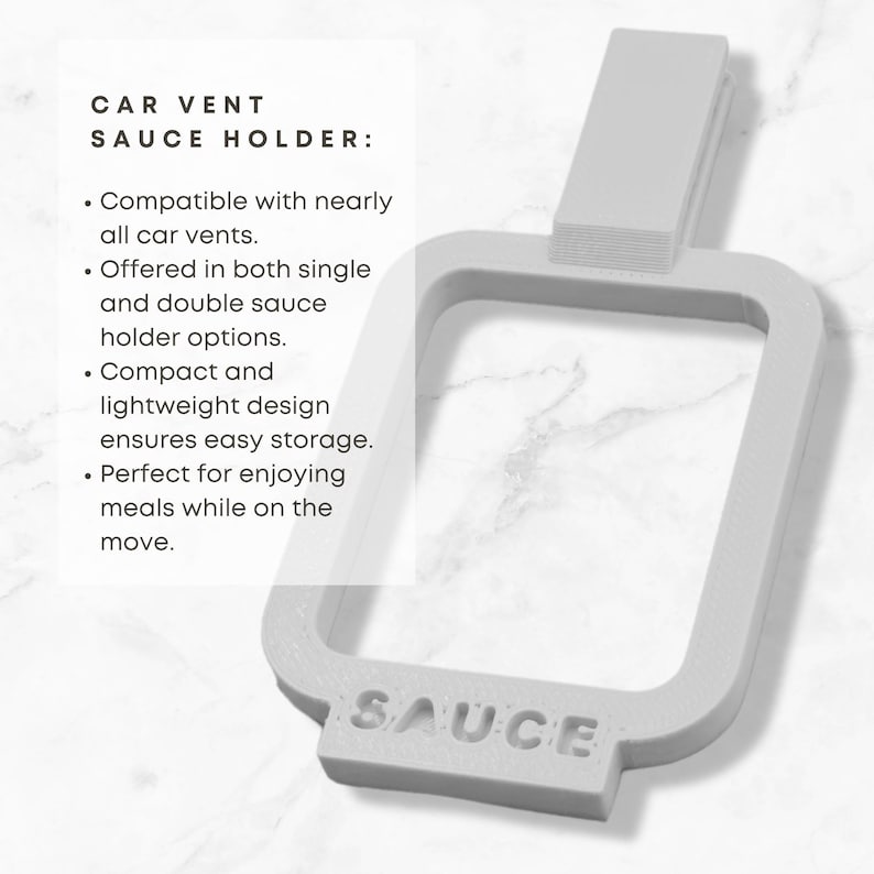 May include: White plastic car vent holder with the word "SAUCE" printed on the bottom. The holder is designed to hold a single or double sauce container.