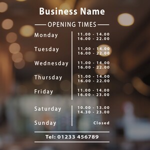 May include: A white sign with black text listing business hours for a business called "Business Name". The sign lists the hours of operation for each day of the week, including Monday through Sunday. The sign also includes a phone number: Tel: 01233 456789.