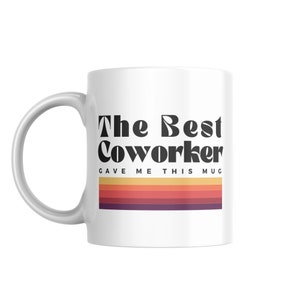 May include: White ceramic mug with the text "The Best Coworker Gave Me This Mug" in black bold font. The text is above a retro-style striped design in orange, red, and purple.