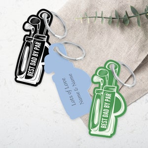 May include: Three keychains with a golf bag design. The keychains are black, light blue, and green. The black keychain says "Best Dad by Par". The light blue keychain says "Lots of Love Name & Name". The green keychain says "Best Dad by Par".