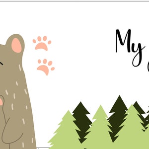 May include: A brown bear with a smaller brown bear cub in its arms. The bears are smiling and have closed eyes. The text "My Daddy Bear" is written in black cursive font. The background is white with green trees at the bottom.