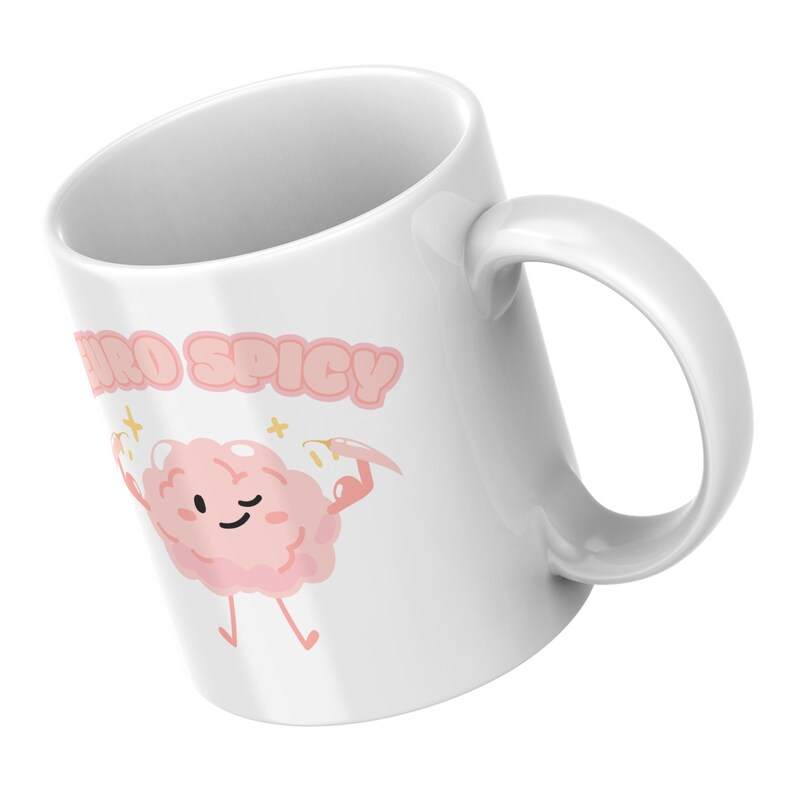 Puede incluir: Taza de cer&aacute;mica blanca con un personaje de dibujos animados de cerebro rosa sosteniendo un chile y el texto "Neuro Spicy".