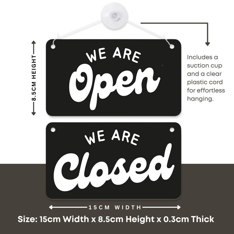 May include: A black and white reversible sign with the words "WE ARE Open" and "WE ARE Closed". The sign is 15cm wide and 8.5cm high, and includes a suction cup and clear plastic cord for hanging.
