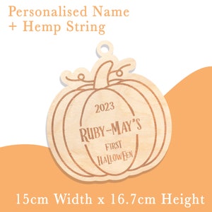 May include: Wooden pumpkin ornament with the text "2023 RUBY-MAY'S FIRST HALLOWEEN" and a hemp string for hanging. The ornament is 15 cm wide and 16.7 cm high.