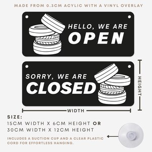 May include: Black rectangular sign with the text "HELLO, WE ARE OPEN" and "SORRY, WE ARE CLOSED". The sign features a stack of tires graphic. The sign is 15cm wide x 6cm high or 30cm wide x 12cm high.