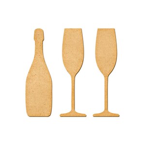 May include: Three cardboard cutouts of a champagne bottle and two champagne flutes.