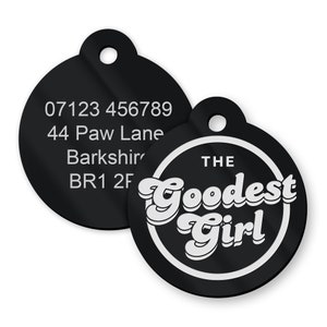 May include: Two black round pet ID tags. One tag has a phone number, address, and postcode. The other tag has white text that reads "THE GOODEST GIRL" in a retro font.