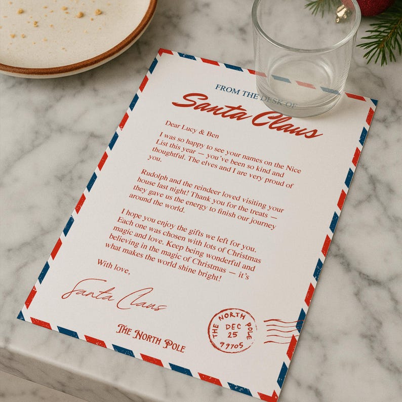 May include: A Christmas-themed letter from Santa Claus, featuring red and blue border details. The letter is addressed to Lucy & Ben and includes a North Pole postmark. A clear glass and a plate are in the background.