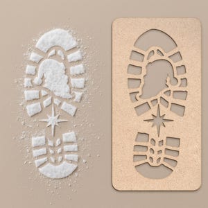 May include: A Christmas-themed image featuring a footprint design. One footprint is made of white powder, depicting Santa Claus and a star. The other is a wooden stencil of the same design. The background is a light tan color.