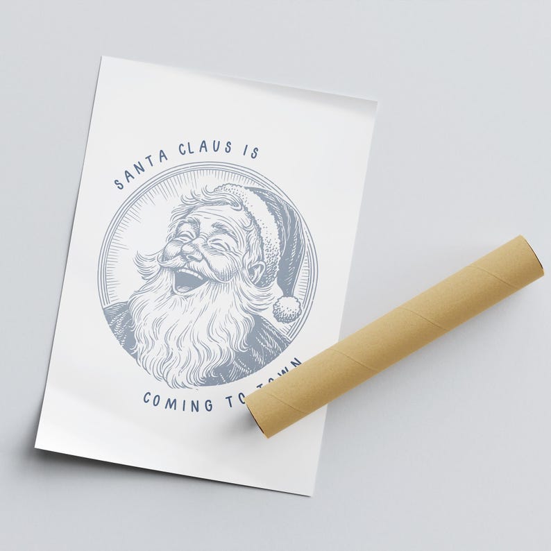 May include: A white poster with a blue illustration of Santa Claus laughing. The text "SANTA CLAUS IS COMING TO TOWN" is written in blue below the illustration.