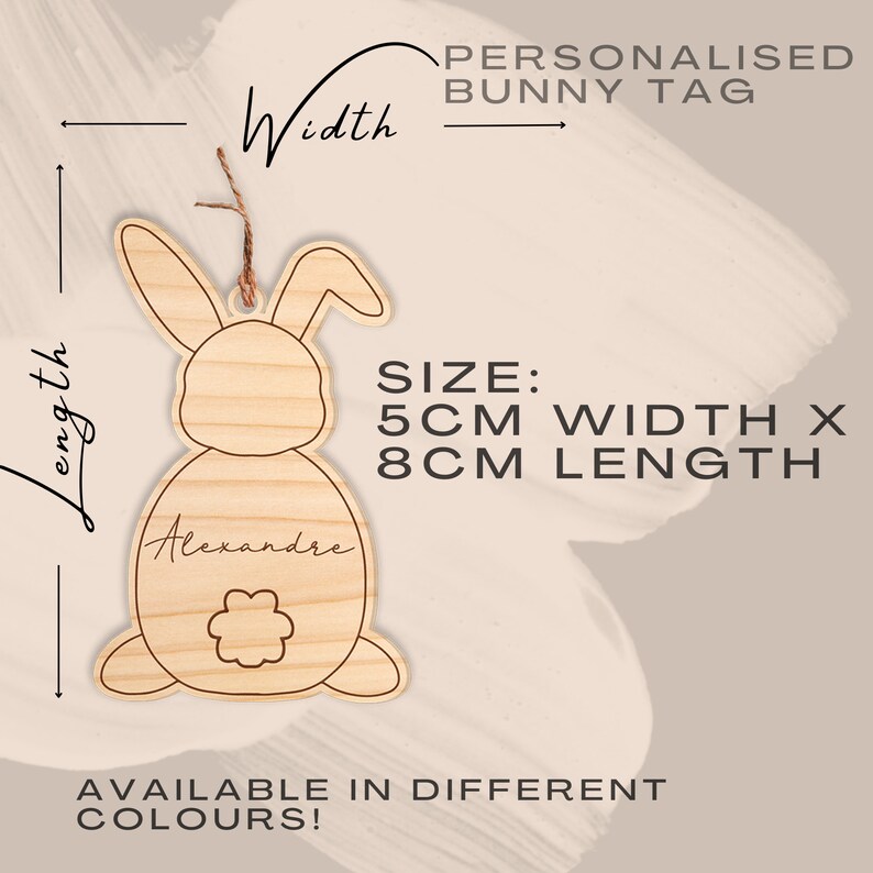 May include: A wooden bunny-shaped tag with a flower on the back. The tag is 5 inches wide and 8 inches long. It is personalized with the name "Alexandre".