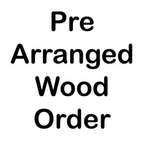 May include: Pre-arranged wood order. This is a sign for a business that sells wood.