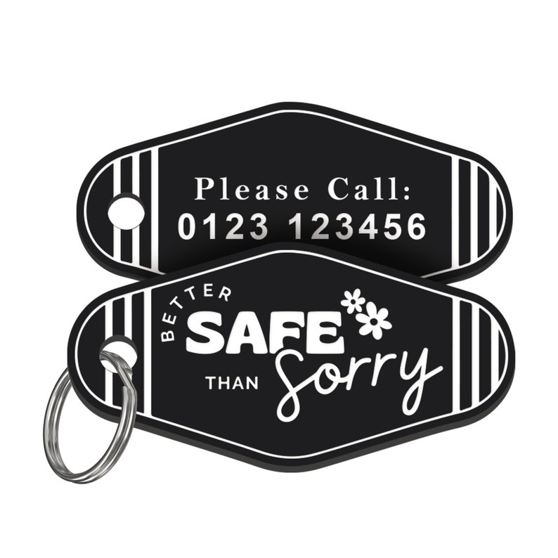 May include: Black and white key chain with a black diamond-shaped tag that says "Better Safe Than Sorry" with a flower graphic. The other side of the tag has a phone number that says "Please Call: 0123 123456".