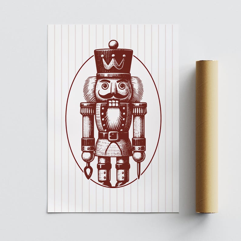 May include: A print of a nutcracker soldier in a maroon color, with a crown and mustache, inside an oval frame. The background is white with vertical stripes. A rolled-up poster is on the right.