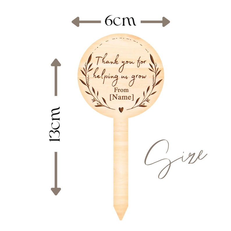 May include: Wooden garden stake with a round sign that says "Thank you for helping us grow. From [Name]" with a small heart. The stake is 13 cm tall and 6 cm wide.