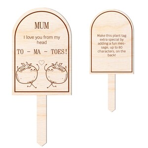 May include: Wooden plant tag with a heart and two cartoon tomatoes. The text reads "MUM I love you from my head TO - MA - TOES!"  Make this plant tag extra special by adding a fun message, up to 80 characters, on the back!
