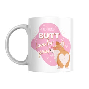 May include: White ceramic mug featuring a cartoon corgi with heart-shaped markings and sunglasses. The mug has the text "Nothing Butt Love for you!" in a pink and gold design. A fun gift for dog lovers.