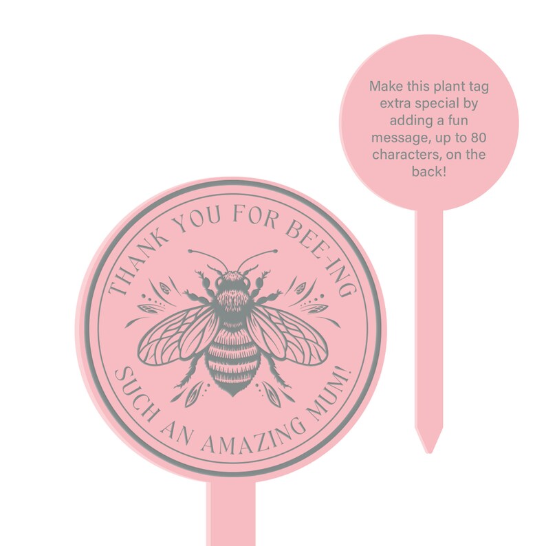 May include: Pink plant tag with a gray bee illustration and the text "THANK YOU FOR BEE-ING SUCH AN AMAZING MUM!"  The tag is round and has a pointed stake on the back.