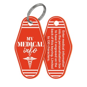 May include: Red motel key chain with a white medical symbol and the text "MY MEDICAL info". The back of the keychain has instructions for personalization.