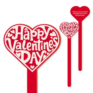 May include: Two red heart-shaped signs with white lettering. The larger sign says "Happy Valentines Day" and the smaller sign says "Happy Valentines Day".