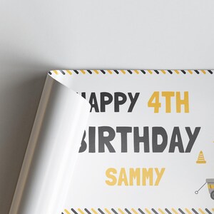 May include: A white birthday poster with the text "Happy 4th Birthday Sammy" in black and yellow. The poster has a construction theme with a yellow and black border.