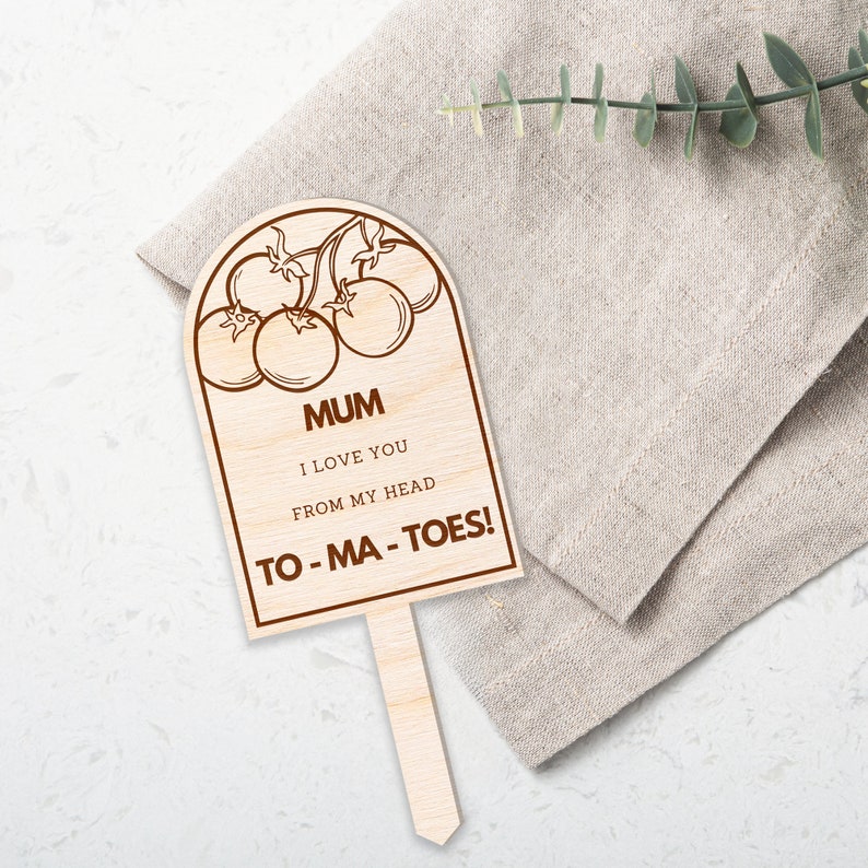 May include: Wooden sign with a brown tomato illustration and the text "MUM I LOVE YOU FROM MY HEAD TO-MA-TOES!"