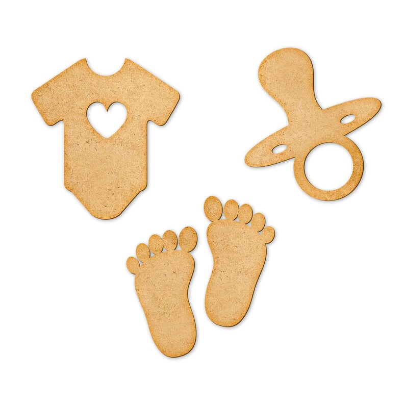 May include: Three wooden cutouts in the shape of a baby onesie, a pacifier, and two baby feet. The onesie has a heart cutout in the center. The pacifier has a ring handle. The feet are simple outlines.