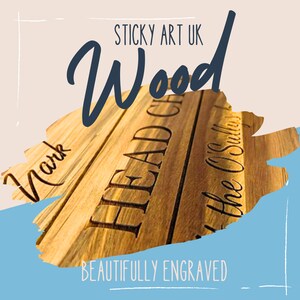 May include: A close-up of a wooden cutting board with the words "HEAD CHEF" engraved on it. The board is beautifully engraved with the names "Mark" and "The O'Sullivans".