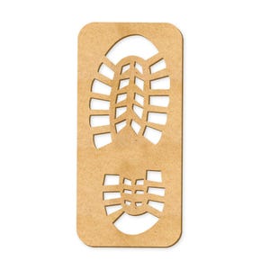 May include: A brown wooden cutout of a boot print. The print has a detailed tread pattern.