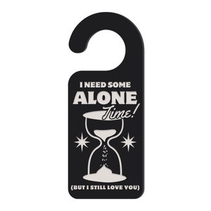 May include: Black door hanger with a white hourglass and the text "I need some alone time! (But I still love you)"