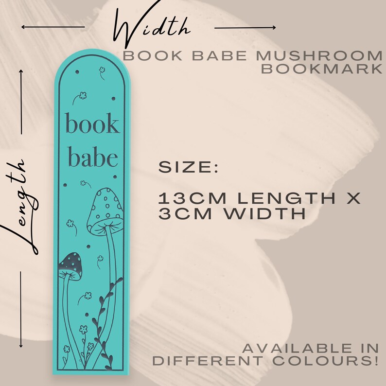 May include: A turquoise blue bookmark with a mushroom and floral design. The bookmark is 13 inches long and 3 inches wide. The text "book babe" is printed on the bookmark.