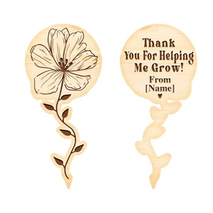 May include: Wooden flower-shaped sign with the text "Thank You For Helping Me Grow! From [Name]" and a small heart. The sign is attached to a wooden stem with leaves.