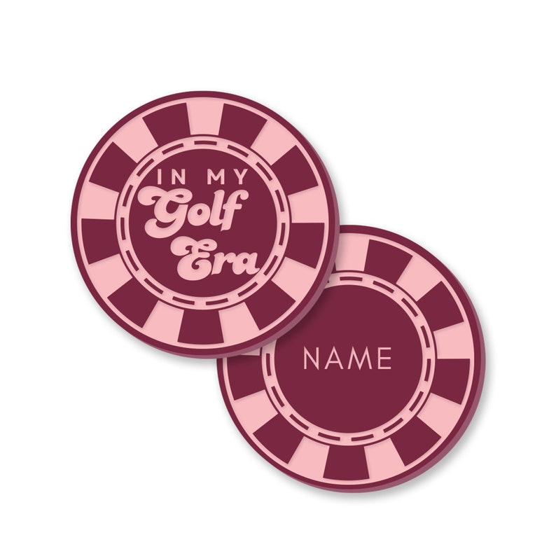 May include: Two pink and maroon round coasters with a white border and a checkered pattern. One coaster says "In My Golf Era" in pink text. The other coaster has a blank space for a name.