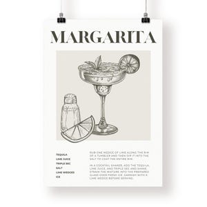 May include: A black and white illustration of a margarita cocktail with a lime wedge, salt, and ice. The text "MARGARITA" is at the top of the image. The recipe for a margarita is listed below the illustration.