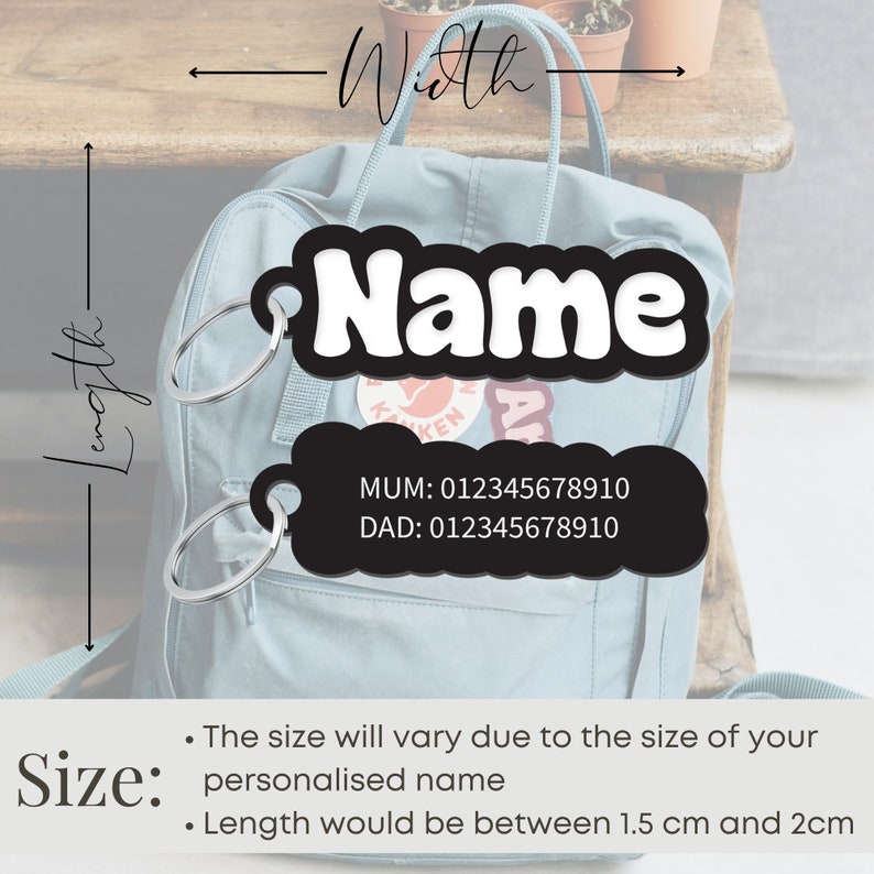 May include: Black and white personalized name tag with a silver key ring. The tag has a white background with black text that says "Name" and a black background with white text that says "MUM: 012345678910" and "DAD: 012345678910". The tag is attached to a blue backpack.