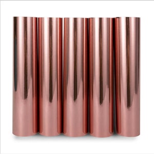 May include: Six rolls of rose gold metallic vinyl, each roll is approximately 12 inches wide.