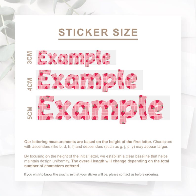 May include: A white background displays sticker size examples. The word "Example" is shown in three sizes: 3cm, 4cm, and 5cm. The text is pink with a strawberry pattern. The text "STICKER SIZE" is at the top.
