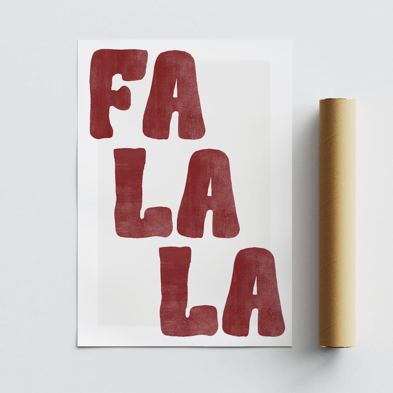 May include: A white poster with the words "FA LA LA" in a bold, red font. The poster is rolled up and secured with a brown paper tube. The design is simple and festive, perfect for holiday decor.