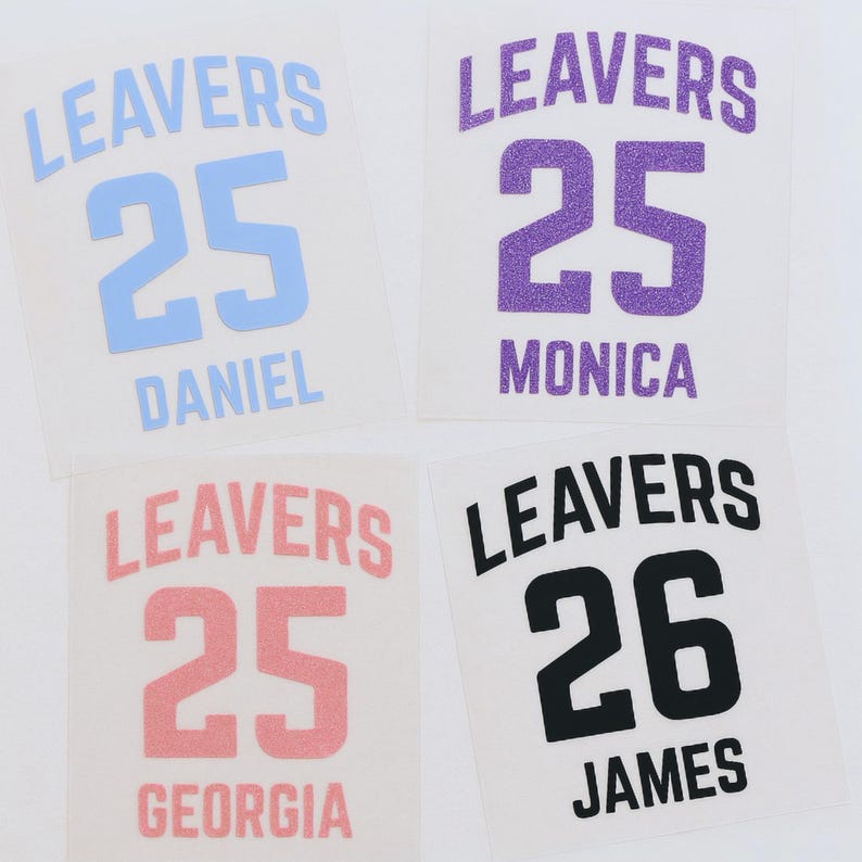 May include: Four personalized iron-on transfers with the word "LEAVERS" above a number and a name. The transfers are in blue, purple, pink, and black. The numbers are 25 and 26. Names include Daniel, Monica, Georgia, and James.