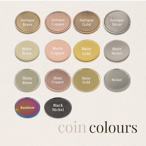 May include: A chart of coin colors with 12 different color options, including antique brass, antique copper, antique gold, antique silver, matte brass, matte copper, matte gold, matte nickel, shiny brass, shiny copper, shiny gold, nickel, black nickel, and rainbow.