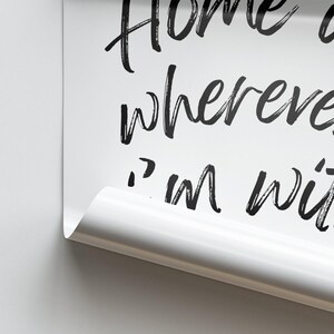 May include: White background with black text that reads "Home is wherever I'm with you".