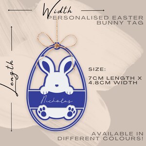 May include: A blue and white Easter bunny tag in an egg shape, personalized with the name "Nicholas." The tag is 7cm long and 4.8cm wide, with a bunny design and paw prints. The tag is suspended by a twine string. The text "PERSONALISED EASTER BUNNY TAG" is visible.