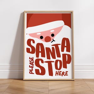 May include: A red and white printable sign with a cartoon Santa Claus face and the text "PLEASE SANTA STOP HERE".