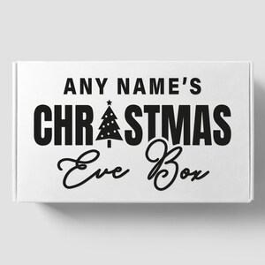 May include: White box with black text that reads "ANY NAME'S CHRISTMAS Eve Box". A small black Christmas tree icon is above the word "Christmas".