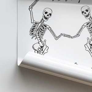 May include: Two black skeletons dancing with their arms linked. The skeletons are on a white background.