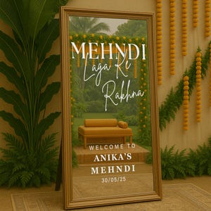 以下が含まれることがあります： 白い筆記体で「MEHNDI Laga Ke Rakhna」と書かれた、大きな金色のフレームの鏡。鏡には庭の風景と小さなマスタード色のソファが映っています。「WELCOME TO ANIKA'S MEHNDI 30/05/25」という文字も表示されています。