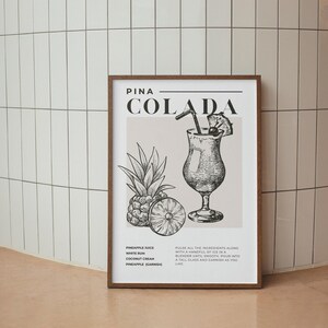 May include: A black and white illustration of a Pina Colada cocktail recipe. The image includes a drawing of a pineapple, a glass of Pina Colada, and the ingredients: pineapple juice, white rum, coconut cream, and pineapple for garnish. The text "PINA COLADA" is in large, bold letters at the top of the image.