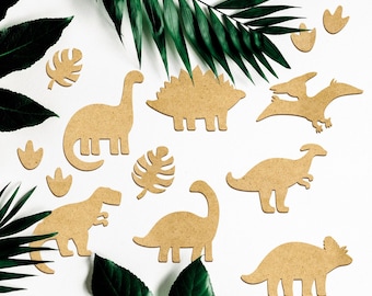 May include: A set of nine brown cardboard dinosaur cutouts, including a stegosaurus, triceratops, brachiosaurus, pterodactyl, and a few others. The cutouts are arranged on a white background with green leaves.